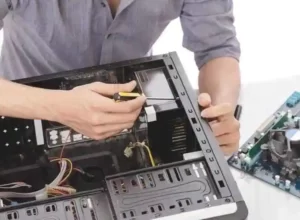 A person is laptop windows repair in the interior of a desktop